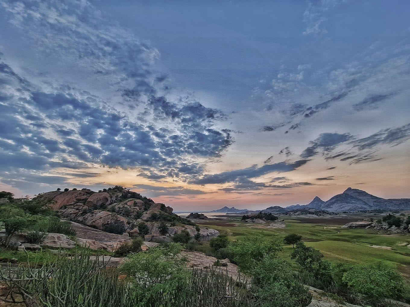 Orange sunset over rocky Jawai terrain